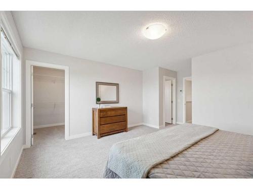 130 Reunion Landing Nw, Airdrie, AB - Indoor Photo Showing Bedroom