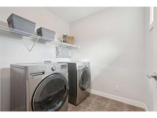 130 Reunion Landing Nw, Airdrie, AB - Indoor Photo Showing Laundry Room