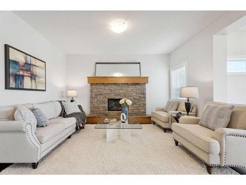 130 Reunion Landing Nw, Airdrie, AB - Indoor Photo Showing Living Room With Fireplace