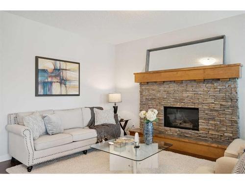 130 Reunion Landing Nw, Airdrie, AB - Indoor Photo Showing Living Room With Fireplace