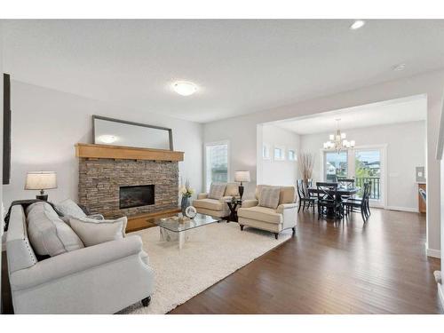 130 Reunion Landing Nw, Airdrie, AB - Indoor Photo Showing Living Room With Fireplace