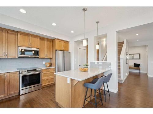 130 Reunion Landing Nw, Airdrie, AB - Indoor Photo Showing Kitchen With Upgraded Kitchen