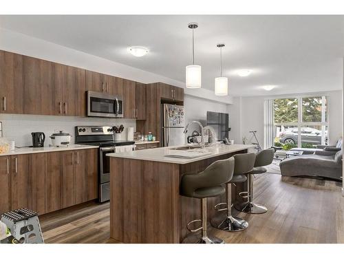 11-303 Waddy Lane, Strathmore, AB - Indoor Photo Showing Kitchen With Stainless Steel Kitchen