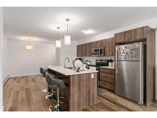 11-303 Waddy Lane, Strathmore, AB - Indoor Photo Showing Kitchen With Stainless Steel Kitchen