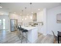 148 Magnolia Common Se, Calgary, AB  - Indoor Photo Showing Kitchen With Stainless Steel Kitchen With Upgraded Kitchen 