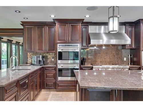 40 Eagle Ridge Place Sw, Calgary, AB - Indoor Photo Showing Kitchen With Double Sink With Upgraded Kitchen