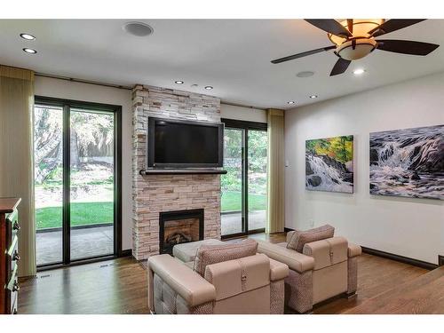 40 Eagle Ridge Place Sw, Calgary, AB - Indoor Photo Showing Living Room With Fireplace