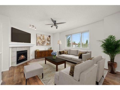 44 Crystalridge Close, Okotoks, AB - Indoor Photo Showing Living Room With Fireplace