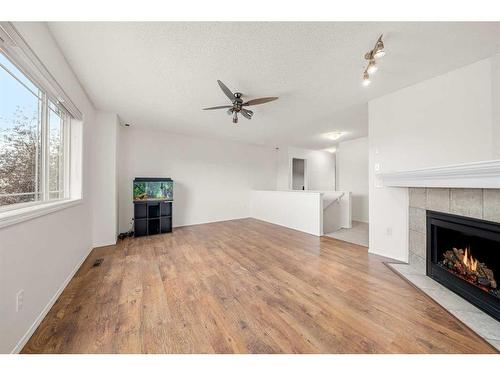 44 Crystalridge Close, Okotoks, AB - Indoor Photo Showing Living Room With Fireplace