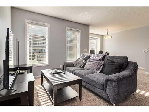 324 Windstone Gardens Sw, Airdrie, AB - Indoor Photo Showing Living Room