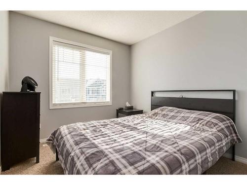 324 Windstone Gardens Sw, Airdrie, AB - Indoor Photo Showing Bedroom