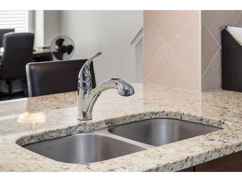 324 Windstone Gardens Sw, Airdrie, AB - Indoor Photo Showing Kitchen With Double Sink