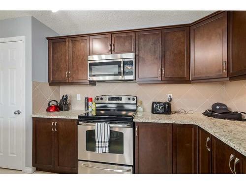 324 Windstone Gardens Sw, Airdrie, AB - Indoor Photo Showing Kitchen With Stainless Steel Kitchen