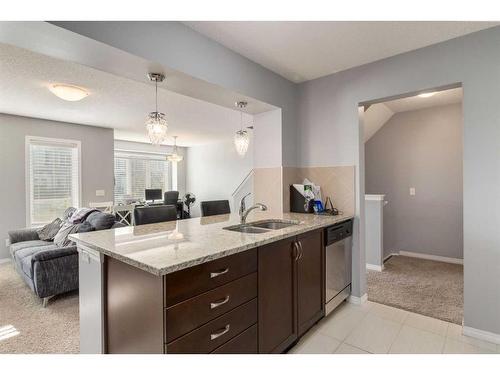 324 Windstone Gardens Sw, Airdrie, AB - Indoor Photo Showing Kitchen With Double Sink