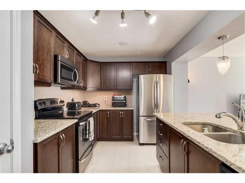 324 Windstone Gardens Sw, Airdrie, AB - Indoor Photo Showing Kitchen With Stainless Steel Kitchen With Double Sink