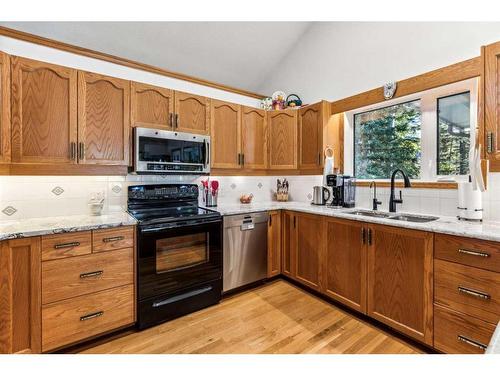 73 Manyhorses Drive, Rural Rocky View County, AB - Indoor Photo Showing Kitchen With Double Sink