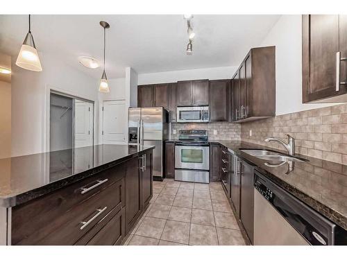 201-88 Arbour Lake Road Nw, Calgary, AB - Indoor Photo Showing Kitchen With Stainless Steel Kitchen With Double Sink With Upgraded Kitchen