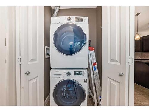 201-88 Arbour Lake Road Nw, Calgary, AB - Indoor Photo Showing Laundry Room