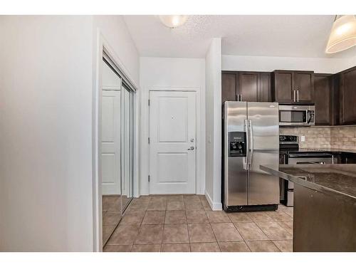 201-88 Arbour Lake Road Nw, Calgary, AB - Indoor Photo Showing Kitchen With Stainless Steel Kitchen