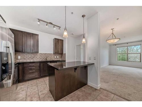 201-88 Arbour Lake Road Nw, Calgary, AB - Indoor Photo Showing Kitchen With Upgraded Kitchen