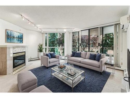 202-804 3 Avenue Sw, Calgary, AB - Indoor Photo Showing Living Room With Fireplace