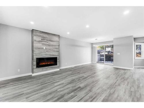 52 Templeby Drive Ne, Calgary, AB - Indoor Photo Showing Living Room With Fireplace