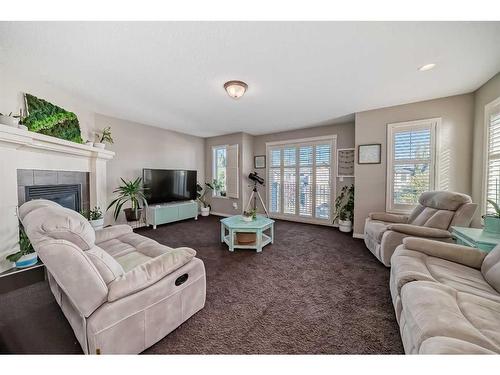 51 Cranberry Circle Se, Calgary, AB - Indoor Photo Showing Living Room With Fireplace