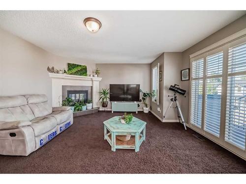 51 Cranberry Circle Se, Calgary, AB - Indoor Photo Showing Living Room With Fireplace