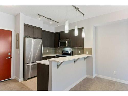 1103-175 Silverado Boulevard Sw, Calgary, AB - Indoor Photo Showing Kitchen With Stainless Steel Kitchen With Double Sink With Upgraded Kitchen