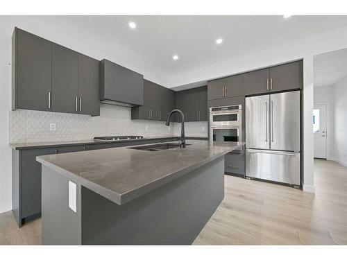 206 Marmot Walk Nw, Calgary, AB - Indoor Photo Showing Kitchen With Upgraded Kitchen