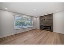 76 Lake Huron Place Se, Calgary, AB  - Indoor Photo Showing Living Room With Fireplace 