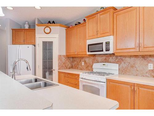 109 Panamount Road Nw, Calgary, AB - Indoor Photo Showing Kitchen With Double Sink