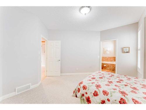 109 Panamount Road Nw, Calgary, AB - Indoor Photo Showing Bedroom