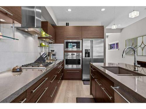 502-105 Stewart Creek Rise, Canmore, AB - Indoor Photo Showing Kitchen With Double Sink With Upgraded Kitchen