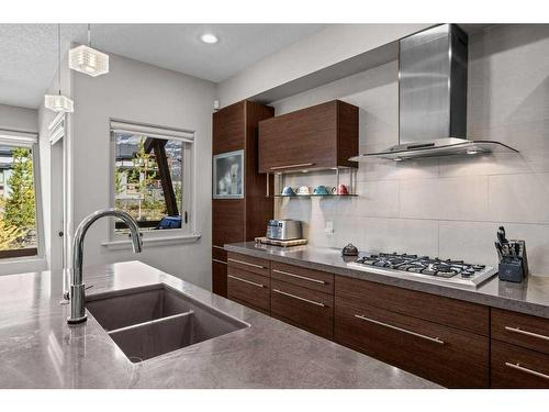 502-105 Stewart Creek Rise, Canmore, AB - Indoor Photo Showing Kitchen With Double Sink With Upgraded Kitchen