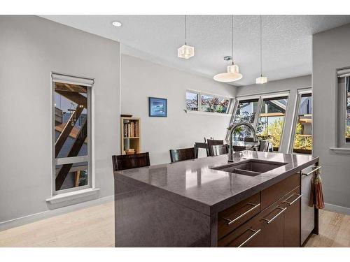 502-105 Stewart Creek Rise, Canmore, AB - Indoor Photo Showing Kitchen With Double Sink