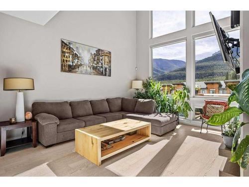 502-105 Stewart Creek Rise, Canmore, AB - Indoor Photo Showing Living Room