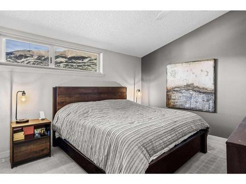 502-105 Stewart Creek Rise, Canmore, AB - Indoor Photo Showing Bedroom