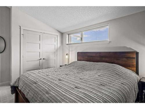 502-105 Stewart Creek Rise, Canmore, AB - Indoor Photo Showing Bedroom