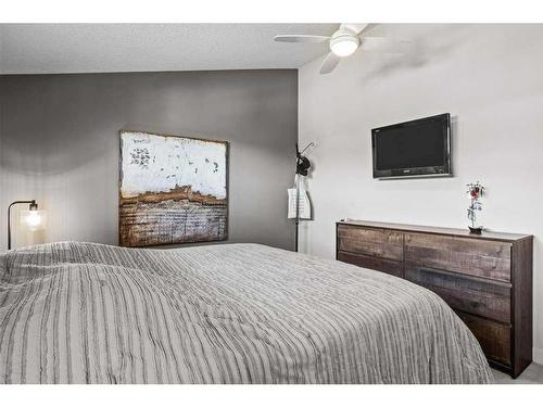 502-105 Stewart Creek Rise, Canmore, AB - Indoor Photo Showing Bedroom