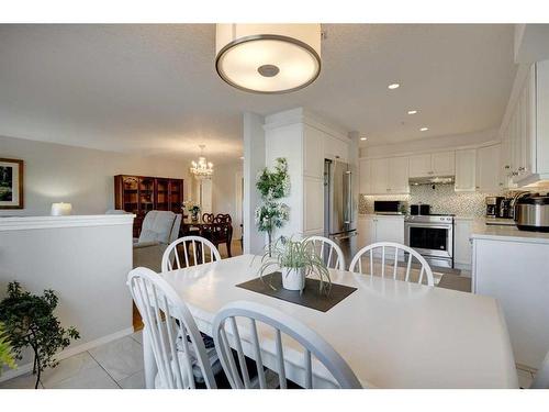 128-7229 Sierra Morena Boulevard Sw, Calgary, AB - Indoor Photo Showing Dining Room