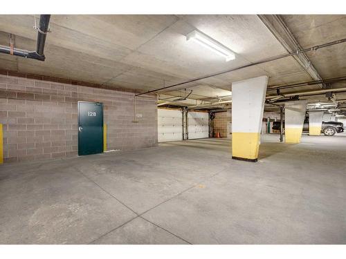 128-7229 Sierra Morena Boulevard Sw, Calgary, AB - Indoor Photo Showing Garage