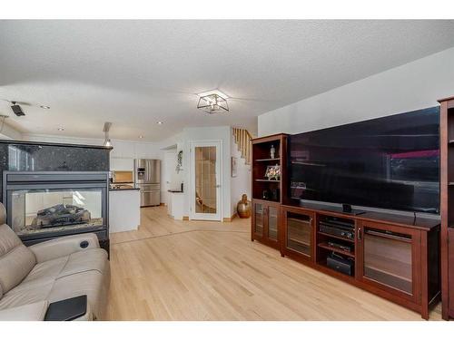 472 Sierra Morena Place Sw, Calgary, AB - Indoor Photo Showing Living Room With Fireplace