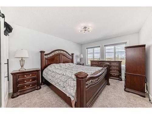 25 Silverton Glen Way Sw, Calgary, AB - Indoor Photo Showing Bedroom