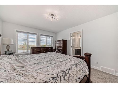 25 Silverton Glen Way Sw, Calgary, AB - Indoor Photo Showing Bedroom