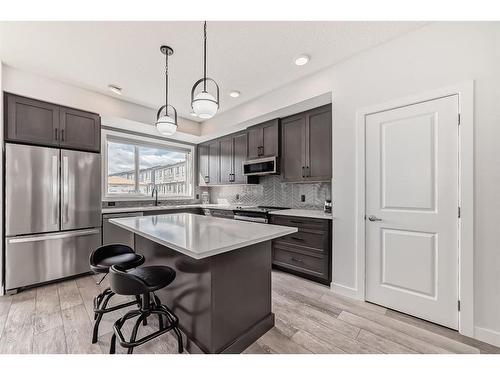 25 Silverton Glen Way Sw, Calgary, AB - Indoor Photo Showing Kitchen With Stainless Steel Kitchen With Upgraded Kitchen