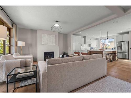 43 Bluerock Avenue Sw, Calgary, AB - Indoor Photo Showing Living Room With Fireplace