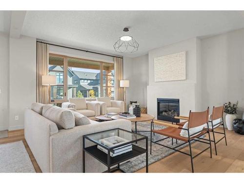 43 Bluerock Avenue Sw, Calgary, AB - Indoor Photo Showing Living Room With Fireplace