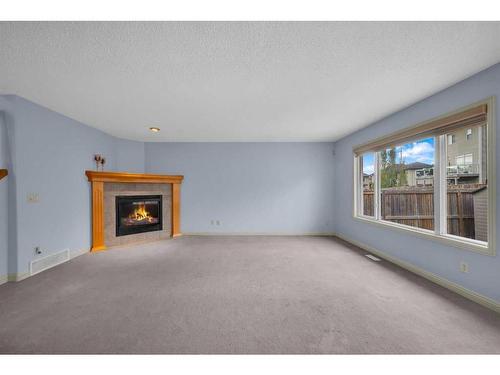 1113 Kincora Drive Nw, Calgary, AB - Indoor Photo Showing Living Room With Fireplace