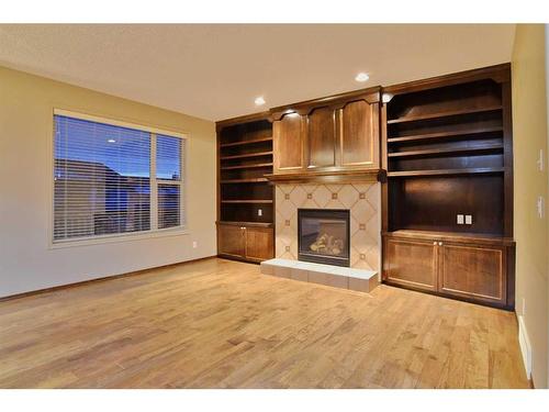 7 Pantego Rise Nw, Calgary, AB - Indoor Photo Showing Living Room With Fireplace